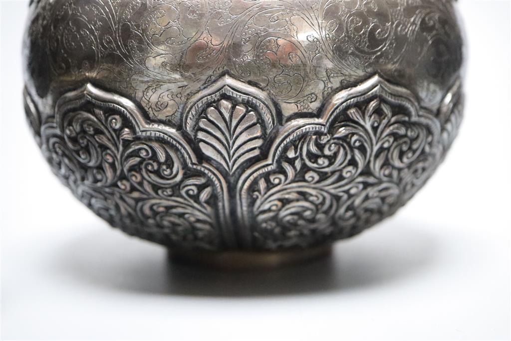 An Indonesian? embossed and engraved white metal squat vase, height 12.2cm and two similar lidded pots,